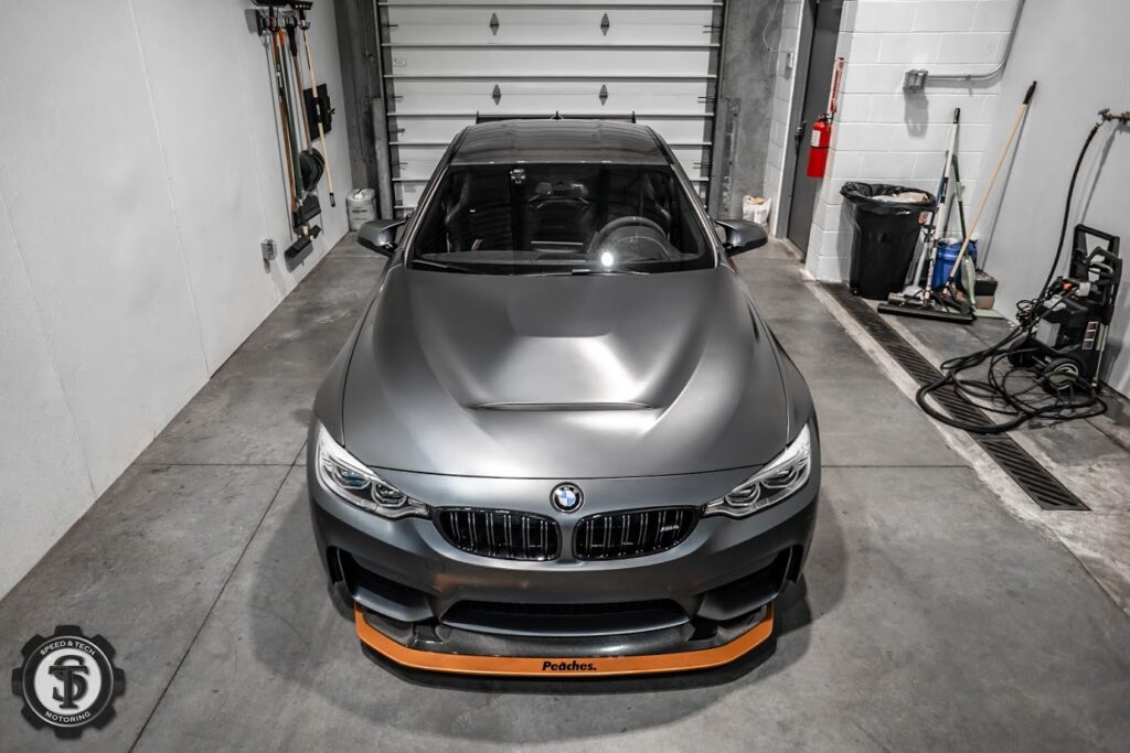 "Expert window tinting on a BMW M4 at Speed & Tech Motoring in Sterling, VA