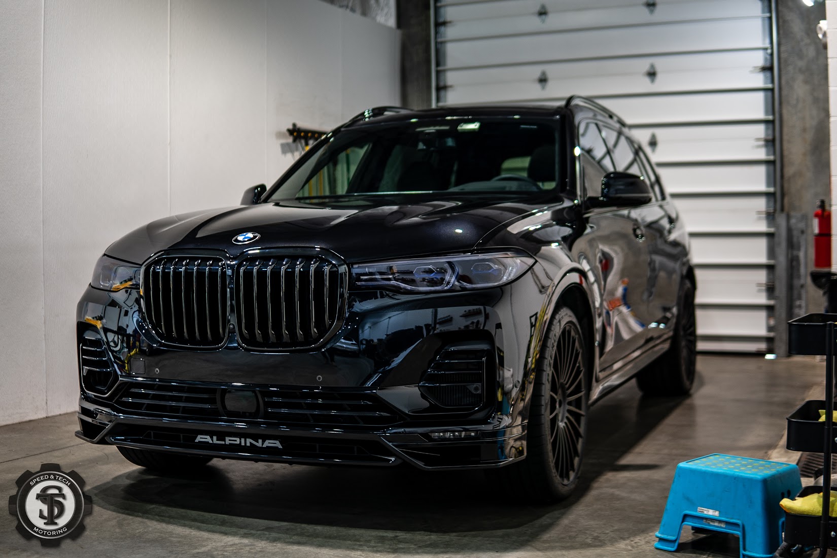 BMW X7 exhibiting a pristine finish after auto detailing and paint correction service at Speed and Tech Motoring in Sterling, VA.