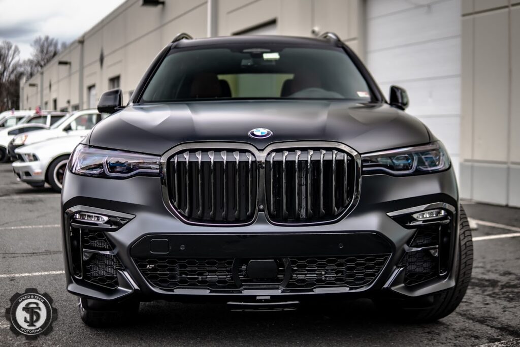 BMW X7 featuring windshield Paint Protection Film applied by Speed and Tech Motoring in Sterling, VA, ensuring protection against chips and scratches while maintaining visibility.